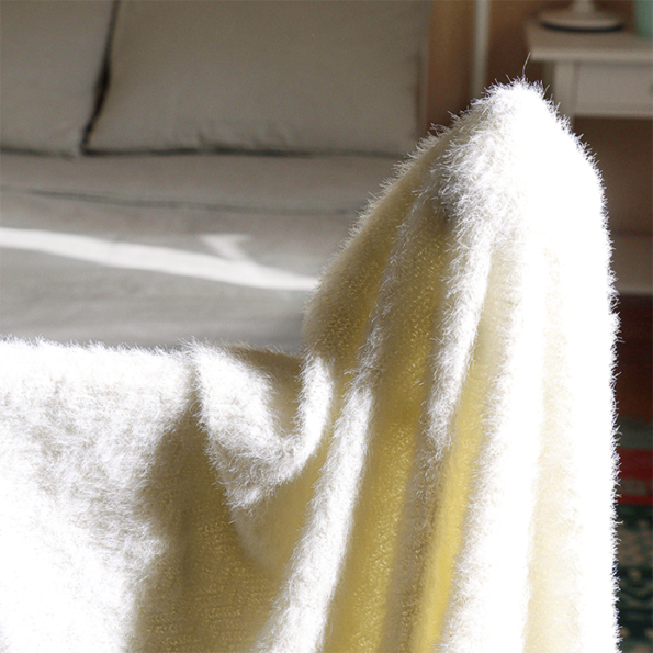 Soft and silky off-white bed throw blanket